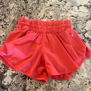 red track runner lululemon shorts